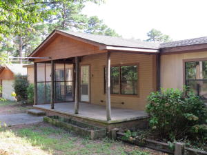 Private setting on 3.01 acres will bring many happy memories. Spend your time in the above ground pool or relaxing in the hot tub! This unique manufactured home with split floor plan, 4 bedrooms and 3 bath is perfect for the large family! New A/C unit in 2014 and new roof in 2013. Great buy for privacy close to town and room to garden or build a new space! Call today for your personal tour.