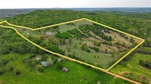 With 4 ponds, hay barn and working pens this property is ready for your livestock. Well and septic from old home place exist but have not been used by current owner. Owner has made numerous improvements to property including, but not limited to adding 25 ft to hay barn, upgrading all fencing and clearing additional trees to increase pasture. Existing single wide with add on is given no value. It i will make a great storage space. Seller does hunt this property and harvest at least 1 deer each year.