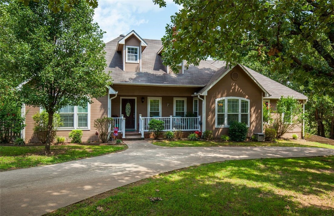 Welcome Home!! Rare find in Bentonville! Beautiful four bedroom home on two quiet, fenced acres. Oversized bedrooms and bathrooms with ample storage throughout. Large eat-in kitchen is the heart of the home. Office or craft room on main level. This home has two living areas and a large deck and patio overlooking the back yard. Mature trees provide plenty of shade for outdoor entertaining. Well has UV light & water filtration system. Call today for your private showing.