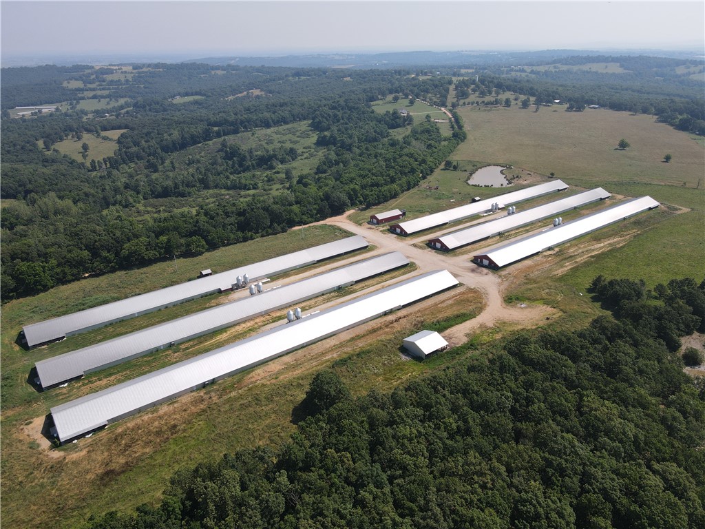 (6) 55 x 600 almost new Tyson houses on 127 acres m/l with 3 bedroom 2 bath farm house all built in 2016 and 2017. Tyson premium contract with incentive. Tractor and some equipment included. Plenty of room for some live stock as well with several of the fields fenced and cross fenced.