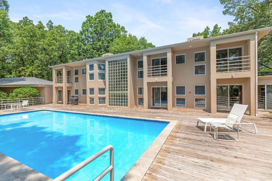 The Residence is located in North Central Arkansas, designed by James Lambeth.  The design integrates the use of passive solar: the north is protected by large stucco and polished marble walls.  The south is open to the winter sun.  Mable surfaces and glass features provide thermal storage.  The entry door is etched with a sundial.  Translucent onyx is above the entrance door.  Incredible home It's a four-bedroom, four-bath beauty nestled in a wooded private setting at the edge of Harrison. The southern view from the home is stunning, especially from the patio area centered around the inground pool. Just minutes from Harrison AR Downtown, approximately 45 minutes to Branson MO and 30 minutes to the beautiful Buffalo River.