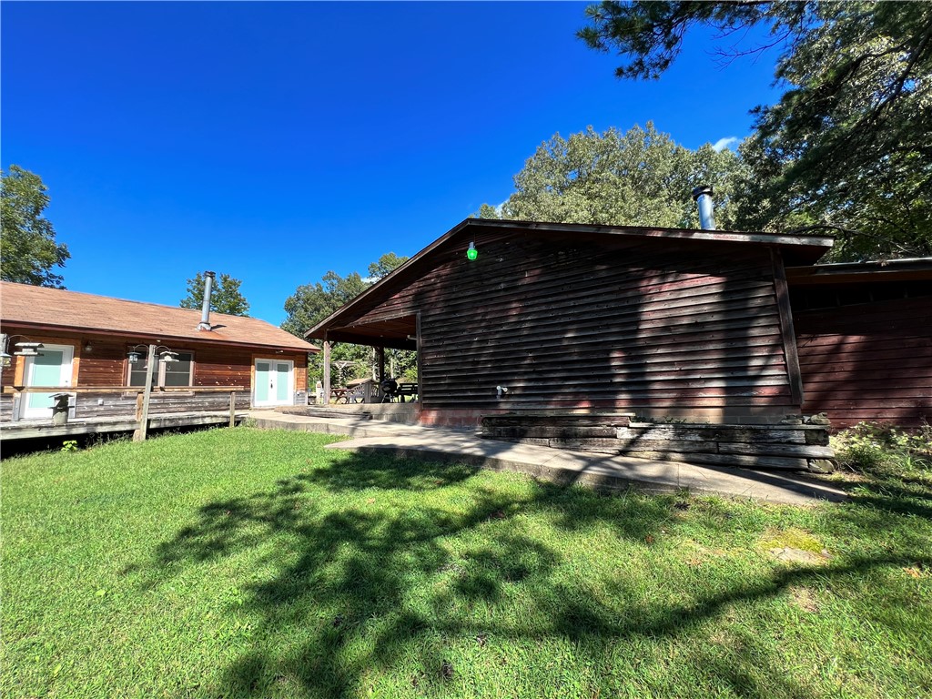 Great country feel with handy highway access. This 3br/2ba home with detached enclosed garage was built with quality in mind. Home has 2x6 walls, NEW ROOF 8-24, solid wood cabinets, and newer vinyl windows. Inside you find an abundance of open floor space, wonderful storage throughout, and a spacious master suite with private living area. Plenty of bonus space and options for living layout. The french doors and many windows bring the outdoors in, plenty of deck and paved porch areas to enjoy this peaceful setting. Property has a spacious feel with a flat yard backing up to woods and mature shade trees. The 24x24 insulated garage/shop building with dual covered patios provides great additional room under roof. Rural setting yet accessible to amenities and the Hwy 412 corridor. So many nice features complete this wonderful place to call home!
