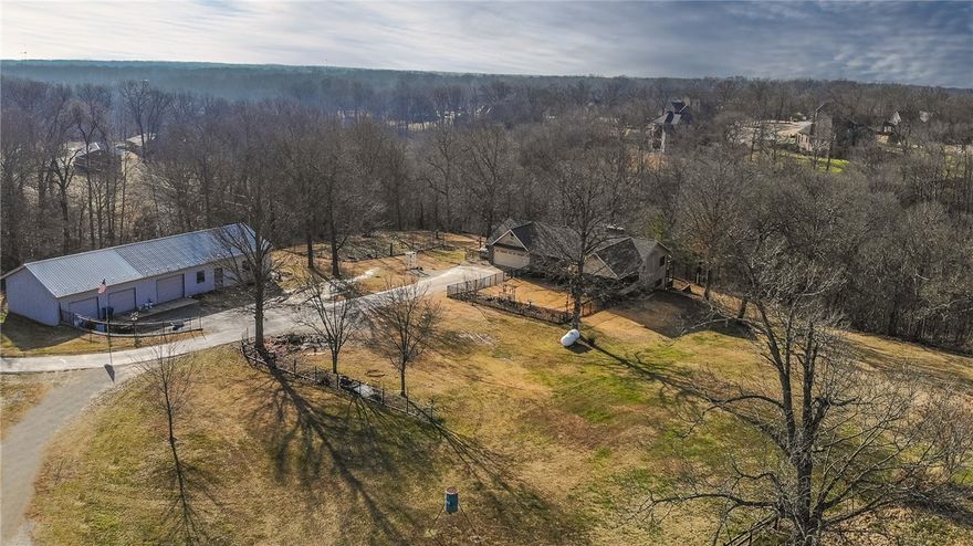 Incredible 55+ Acres in the Punkin Hollow/Peach Orchard Area of Bentonville. Minutes from Coler Creek Mountain Preserve Trail/Mountain Bike Destination and close to Downtown Bentonville. Mostly flat open and rolling pasture with 20+ acres of timber. Property connects directly and borders the neighborhoods of Talamore, Oak Tree and Oak Hills/Victoria Estates. So many unique and amazing opportunities for development, private home sites or recreational use. Property includes a beautiful 3500 sfoot home, 2400sfoot shop building and additional outbuildings. Appointment only showings. Also listed as Land under MLS#1170793.