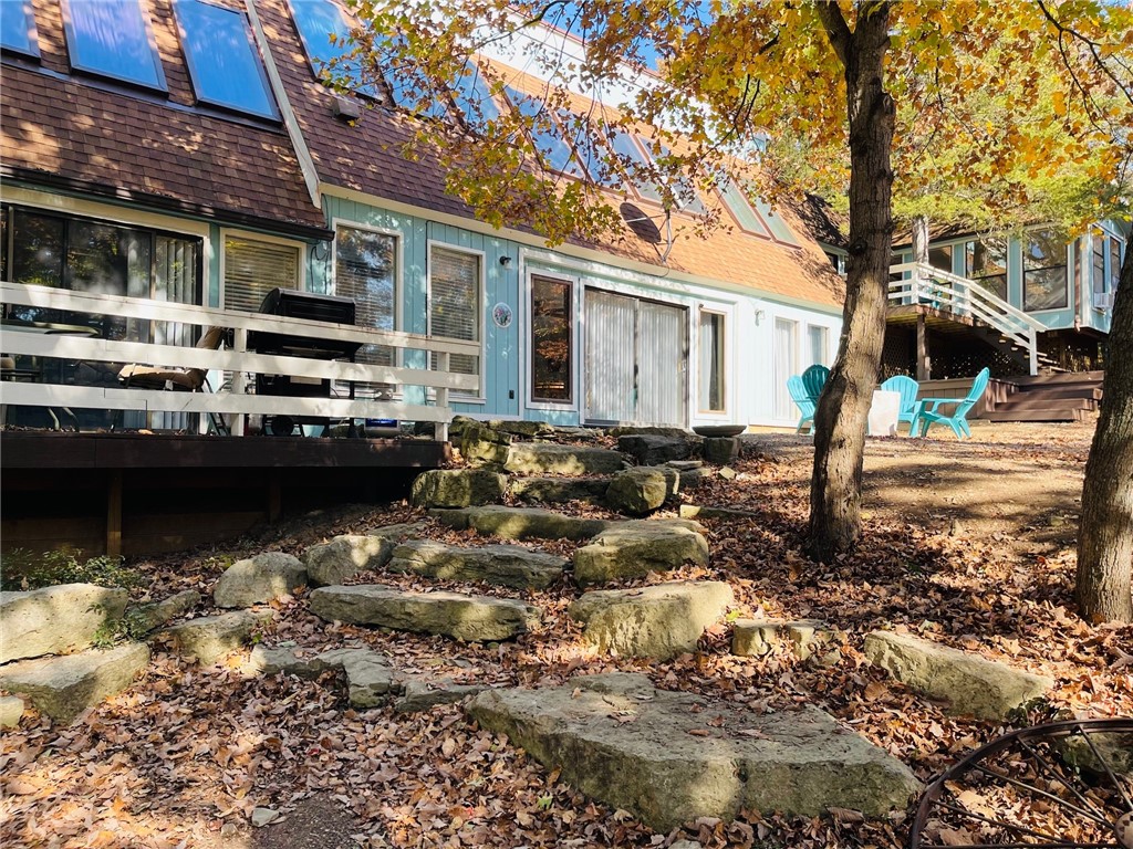 Very rarely does this remarkable type property become available. What is known as Stoney Point, Kings River flows below this breathtaking home.... RIVERFRONT with endless possibilities for a single family home or used presently as 5 Star nightly/weekly rental (comfortably sleeps 16) known as Choyias Place. Beautifully renovated including roof and HVAC with large open areas and private snuggling spots. Specially designed for low energy costs. Great kitchen and large dining areas for family dinners or corporate- church retreats. River access for swimming, kayaking, fishing, floating. Large outdoor areas to sit and relax and listen to the river flow. Wedding venue out under the trees. Lots of extra land for adding cabins, etc. A jewel within minutes of Branson and Eureka Springs, Big Cedar, Top of the Rock and Dogwood Canyon. This is off the beaten path but only 15 minutes to Berryville for shopping, medical, hometown events and the same to Beaver and Tablerock Lakes. Some financing available to qualified buyers.