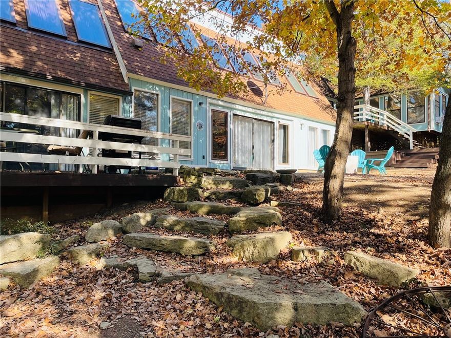 Very rarely does this remarkable type property become available.  What is known as Stoney Point, Kings River flows below this breathtaking home.... RIVERFRONT with endless possibilities for a single family home or used presently as 5 Star nightly/weekly rental (comfortably sleeps 16) known as Choyias Place.  Beautifully renovated including roof and HVAC with large open areas and private snuggling spots. Specially designed for low energy costs. Great kitchen and large dining areas for family dinners or corporate- church retreats. River access for swimming, kayaking, fishing, floating. Large outdoor areas to sit and relax and listen to the river flow.  Wedding venue out under the trees.  Lots of extra land for adding cabins, etc. A jewel within minutes of Branson and Eureka Springs, Big Cedar, Top of the Rock and Dogwood Canyon.  This is off the beaten path but only 15 minutes to Berryville for shopping, medical, hometown events and the same to Beaver and Tablerock Lakes. Some financing available to qualified buyers.