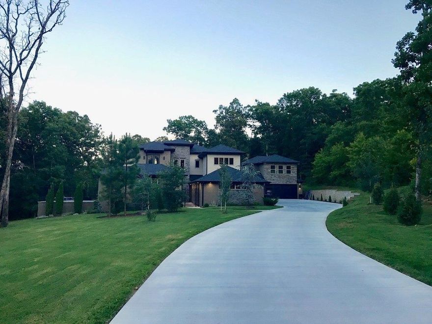 Custom 6,960sf home nestled on 2.18 Acre wooded lot at the end of a cul-de-sac.   Home offers 4 bedroom, 5 full baths, and 2 half baths, 6-car garage with all of the high end features buyers seek. In-ground pool with covered cabana and outdoor kitchen.  Detached 2-car garage includes 710sf. Guest house/studio with private balcony.  Fantastic location with easy access to Fayetteville, I-49, Don Tyson School of Innovation & more!