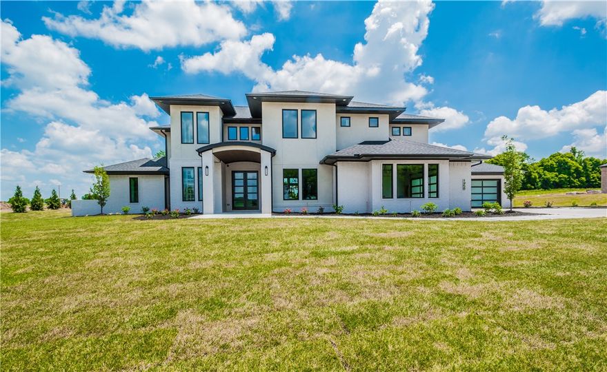 Welcome to West End, the newest and finest gated enclaves, where this 2018 Parade of Homes show-home resides. Nestled on 1.29 acres, this modern masterpiece is meticulously and professionally designed with a brilliant open floor plan. High-end fixtures and finishes include 2 story windows walls, a gorgeous floating staircase, marble & granite countertops, designer lighting and intricate millwork. The carefully conceived floor plan includes 4 guest suites, a study, an impressive great room, gourmet kitchen with wine station & substantial w/i pantry, dining area, kids workstation and 2 bonus rooms! Sensational outdoor living spaces make this home the ultimate entertainers dream!