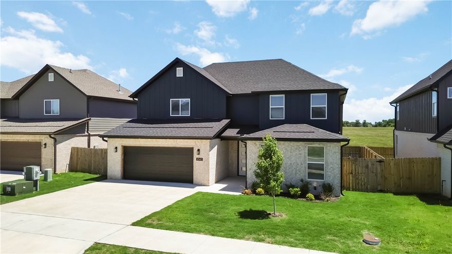 Beautiful 4-bedroom, 3 full bath home featuring a versatile office/library/workout room and an ideal split floor plan. The spacious primary suite is conveniently located downstairs along with an additional secondary bedroom and full bath. This home showcases beautiful upgraded finishes throughout, including quartz countertops, luxury vinyl plank flooring on main floor, upgraded carpet upstairs, and a large walk-in pantry. Second floor offers two additional bedrooms, a full bath, and a spacious media room ideal for entertainment, gaming, or movie nights. Located in a highly desirable area near Bentonville West High School and directly across from Gamble Elementary School, this home combines comfort, style, and convenience with easy access to schools, shopping, dining, and everyday amenities.