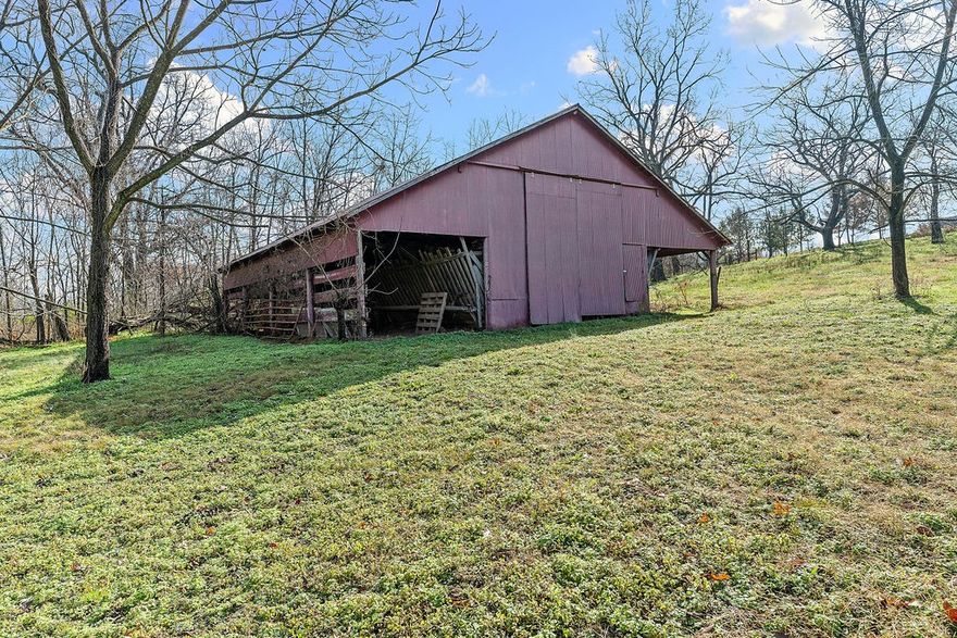 Rare find! 9.94 beautiful acres next to Kinion Lake! Location is amazing with easy access to Farmington, Fayetteville, Prairie Grove but out of town enough to have some peace and quiet! This versatile land offers the perfect setting for your home, complete with two barns, a serene pond, and a charming wet-weather creek that adds to the natural beauty of the landscape. With plenty of open space and peaceful surroundings, this property provides endless possibilities—build your forever home, start a hobby farm, or simply enjoy the quiet country lifestyle. Don’t miss this rare opportunity to create the homestead you’ve been dreaming of! Property is in a partial flood zone