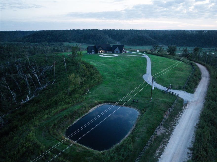Welcome to your dream home in Northwest Arkansas with loads of privacy. Located just 35 minutes to Bentonville, this Modern Custom Built home was just completed in 2025. Nestled on over 30 acres, partially fenced with a gated entrance, this brand-new home offers both sophistication and loaded with style. Inside, you’ll find 3 spacious bedrooms, each with its own en-suite bathroom, plus a guest half bath on the main level. A private office off the living area showcases stunning views of the acreage, while upstairs features an oversized bonus/media room perfect for football games and movie watching nights. The impressive 1,200 sq. ft. garage boasts insulated doors, 9-foot clearance, and a built-in dog wash station. Not only do you have a separate screened in patio, you have a gorgeous outdoor covered patio for entertaining. For peace of mind, the home includes a safe room/tornado shelter and a whole-home Generac system. Don’t miss your chance to own this one-of-a-kind oasis. Schedule your private showing today!
