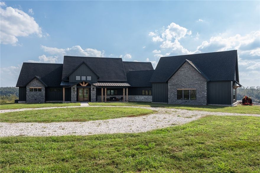 This is the property you’ve been waiting for—where modern design meets true luxury living. Nestled on over 30 acres, partially fenced with a gated entrance, this brand-new custom-built home offers both sophistication and functionality. A charming chicken coop adds to the property’s appeal. Inside, you’ll find 3 spacious bedrooms, each with its own en-suite bathroom, plus a guest half bath on the main level. A private office off the living area showcases stunning views of the acreage, while upstairs features an oversized bonus/media room perfect for cozy movie watching nights. The impressive 1,200 sq. ft. garage boasts insulated doors, 9-foot clearance, and a built-in dog wash station. Not only do you have a separate screened in patio, you have a gorgeous outdoor covered patio for entertaining. For peace of mind, the home includes a safe room/tornado shelter and a whole-home Generac system. Don’t miss your chance to own this one-of-a-kind retreat. Schedule your private showing today!