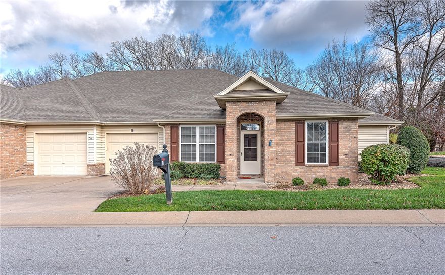 Beautifully updated 2-bedroom, 2-bath townhome in one of Bella Vista’s most desirable areas! Beyond the standard layout, this charming residence features a dedicated formal dining room and a convenient home office/den. The kitchen features newer appliances—including a refrigerator—and beautiful granite countertops. Enjoy a bright sunroom that brings the outdoors in, plus a spacious covered back patio overlooking serene wooded views. Additional perks include built-in storage in both the garage and the attic. The neighborhood offers a private walking trail, clubhouse, and swimming pool, and all exterior maintenance is included for truly low-maintenance living. A peaceful, resort-style setting in an unbeatable location—this one checks all the boxes!