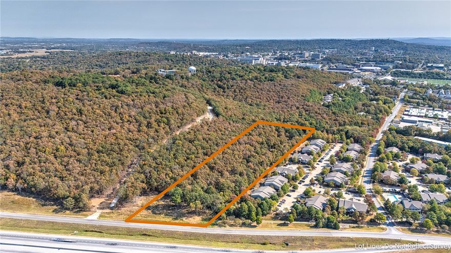 9.14 Acres Just 5 Blocks to the University Of Arkansas Campus.  This land is currently zoned RSF-4 but is in a Area where The New Neighborhood Services General Zoning could be possible. The land is wooded and has multi family apartments adjoining to the south and future project Student housing project that is being proposed adjoining to the North.