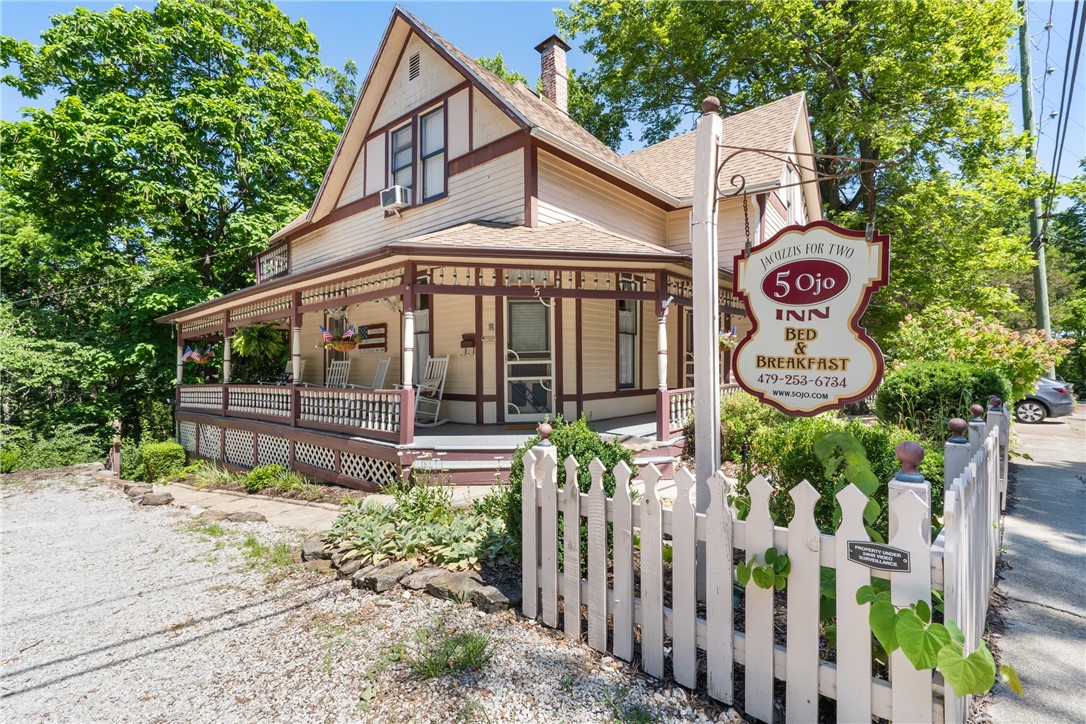 Welcome to the 5 Ojo Inn: The only 4-star historic Bed & Breakfast in Eureka Springs, AR! This exceptional, award-winning bed & breakfast offers unique accommodations with 9 rooms spread across 2 Victorian homes and 2 cottages, each equipped with jetted tubs, fireplaces, complimentary drinks, cable TV, Wi-Fi, refrigerators, and Keurig coffee makers. The property offers a scenic, relaxing setting with a large wooded lot complete with gardens, trails, and wildlife, offering a peaceful retreat for guests. Conveniently located on the historic loop with a trolley stop (red route stop 97) right out front, providing easy access to all of Eureka Springs, or your guests can enjoy a short stroll to Downtown Eureka Springs, with its vibrant shopping, dining, nightlife, and attractions. If you're looking to earn an income, own a thriving business, and enjoy your best life, the 5 Ojo Inn is the perfect opportunity for you!