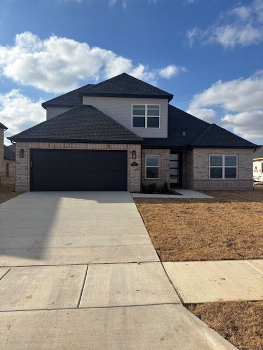 Brand New east facing home within walking distance to Creekside Elementary. 11 Foot ceilings in the living area. Included are granite counters, gas cooktop, washer, dryer, fridge, privacy fence and wired for EV charger. 10 Minutes to Walmart Home Office and Downtown Bentonville.  Get it before it's gone!