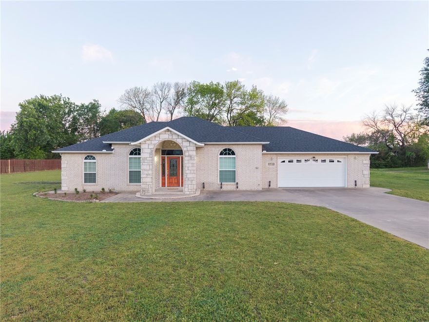 One-owner custom home with flexible living space and standout features! Tax records show 1,844 sq ft, plus an enclosed sunroom (~396 sq ft) with its own heat/air, three sliding doors, and surrounding windows—over 2,200 sq ft total usable space.The living room offers high tray ceilings and wood floors flowing into the dining area. The kitchen features granite counters, abundant cabinetry, and connects to the laundry room and a versatile bonus space—ideal for a 4th bedroom—with an attached flex room/closet and separate garage entry.
The primary suite is filled with natural light, boasts high ceilings, a walk-in closet plus two additional closets, and an ensuite with a jetted tub. Secondary bedrooms are on the opposite side with a hall bath.
The sunroom spans the back with access from dining and bonus rooms and includes an additional range. Situated on .93+-acres with a storage building, sidewalks along perimeter, all on a quiet cul-de-sac near I-40, shopping, and dining.