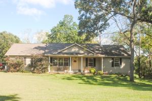 Move in ready house with a workshop and round about drive; new tile floor in the living area; large deck with nice view