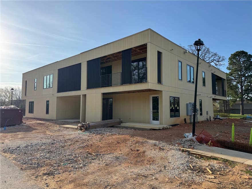 Prime multifamily investment opportunity ideally located the center of one of Northwest Arkansas’ most dynamic and high-demand rental corridors.  Positioned on the U of A bus route and minutes from campus, dining, retail, bike trails and entertainment, the location offers unmatched convenience for students, professionals, and commuters. Easy access to I-49 provides seamless connectivity to Fayetteville, Springdale, Rogers, and Bentonville. This modern complex, built in 2026, showcases clean architectural lines and durable exterior finishes.  8 units in total, each with two bedrooms, two bathrooms a fully equipped kitchen, granite counter tops, luxury vinyl plank flooring, and covered balcony/patio space.  Taxes are estimated.