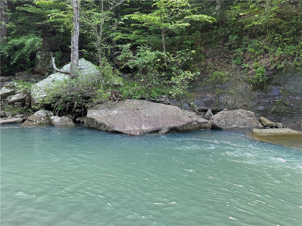 Big Piney Creek frontage and borders National Forest on south side! Escape to your own private slice of the Ozarks with this breathtaking 14.9-acre property in the secluded Walnut area of Newton County, Arkansas. If you’ve been dreaming of a peaceful retreat surrounded by nature, this rare offering delivers in every way. This is a perfect spot for those seeking solitude, adventure, or a scenic place to build a weekend getaway or forever home. With Big Piney Creek running along your property line and the beauty of the Ozarks all around, you’ll be hard-pressed to find another property like this.