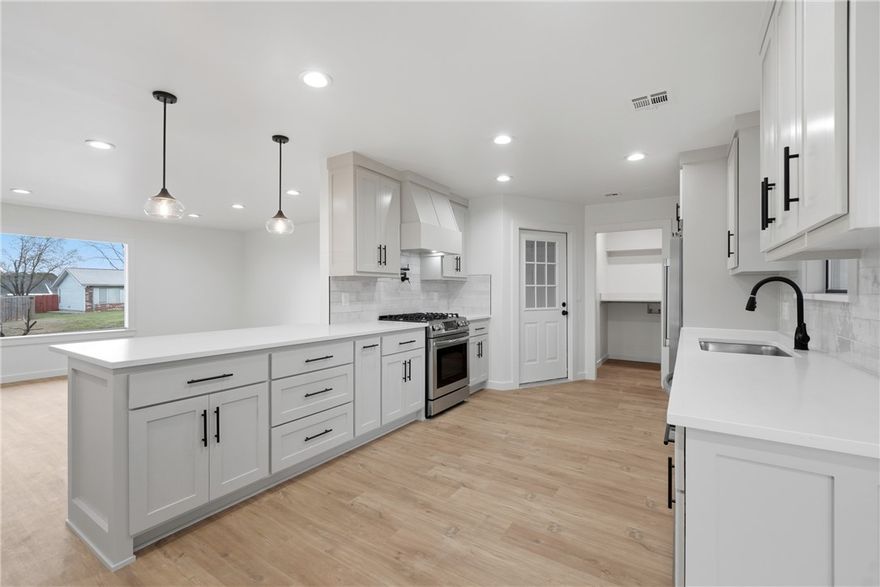 Beautifully remodeled home in the heart of Rogers offering ultra modern updates, a convenient location, and a comfortable layout perfect for everyday living. The home has been completely remodeled with new cabinetry (with spick rack, soft close cabinets, pull out drawers), new flooring, counters, showers, paint, appliances, lighting, fencing, and more, creating a clean and contemporary feel throughout. Situated on a corner lot with a fully fenced yard, the property features 3 bedrooms, 2 full bathrooms, along with spacious walk-in closets that provide ample storage. The covered back patio offers the perfect space to relax or entertain while enjoying the privacy of the backyard. Ideally located less than 1.8 miles from the I-49 interchange and the shopping and dining along W Walnut St (Lowe's, Marshall's, Kohl's, and more)., it's also less than 2.8 miles from Walmart's New World HQ. Walkable (less than .3 miles) from Cambridge Trail and Turtle Creek Bike trail system, offering easy access to outdoor recreation.