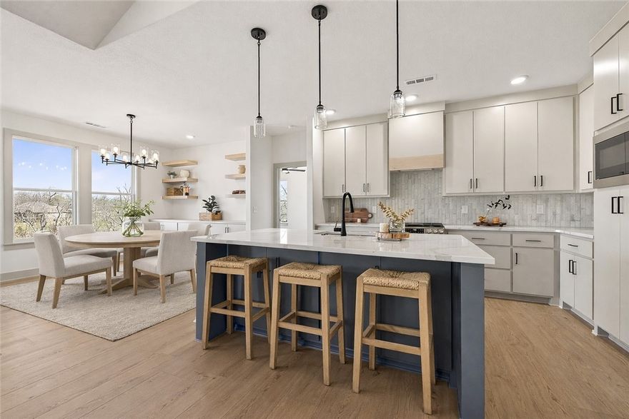 Stunning Modern Luxury New Construction with Breathtaking Ozark Views! Welcome to this exceptional single-story home near Loch Lomond/Approx. 1 mile from Tiree Park and Boat dock. Designed w/ elegance & functionality in mind. Soaring cathedral ceilings & premium finishes throughout—no detail has been overlooked & no expense spared. Step inside to find Luxury Vinyl Plank flooring that flows seamlessly across the spacious layout. The great room is filled w/ natural light from oversized windows that showcase the beautiful Ozarks. The kitchen is an entertainer’s dream, featuring a massive island, tumbled quartz, and custom cabinetry. 3 bedrooms, 2 bathrooms, + an Office w/ built-ins. The primary suite is tucked away in it's own private wing; spa-like bathroom w/ a soaking tub & custom shower w/ full tile accent wall. Enjoy a large covered deck perfect for relaxing or entertaining. Oversized two-car garage with more cabinets. This home truly has it all: style, location, comfort, & views.