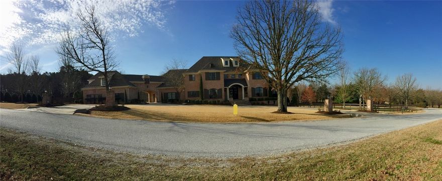 This is a must see with no details missed sitting on 2.46 acres. Wood-Mode cabinetry, thermador appliances, large walk-in closets, heated salt water pool, wood windows, circle drive with extra parking, scraped wood flooring, bonus room with large closet, theater room with 120' screen & new recliners, walk-in storage, professionally landscaped. Close in but country feel. Extensive security with cameras & sound throughout house & back deck.