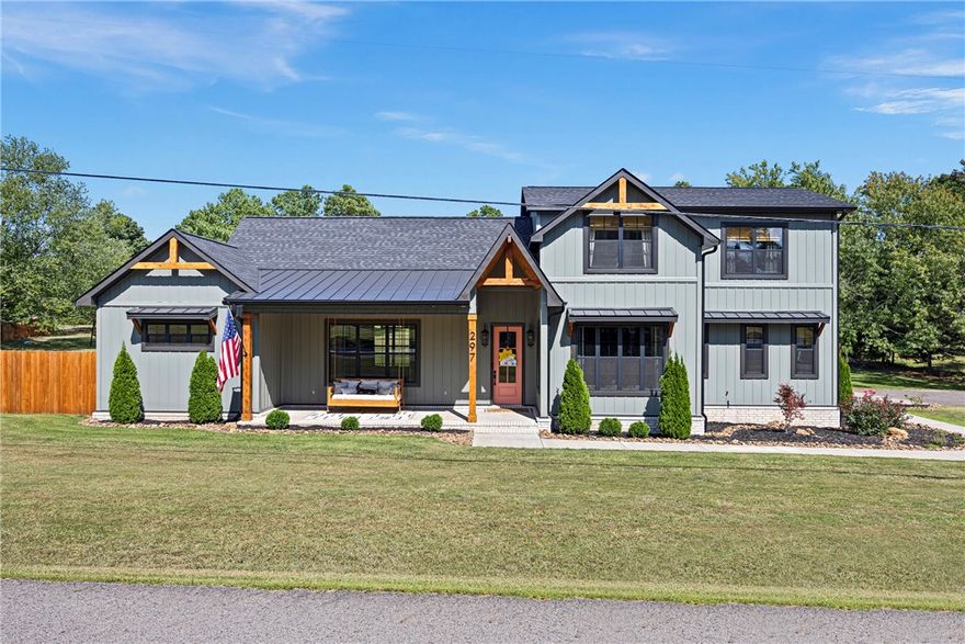 Discover unparalleled luxury in this exquisite five-year-old home on a spacious 2-acre lot in the coveted Cliff and Stream neighborhood. With elevated ceilings and elegant quartz and granite countertops, this residence declares sophistication. Some main features include a grand master suite with custom tile work in the bathroom; a gourmet kitchen that is a chef's dream; the upstairs includes a kitchenette, a three-space study nook and a large walk-in attic for storage. Every detail of this home is meticulously crafted, with no corners cut. An additional bonus is the mudroom, featuring a custom welded kennel and dog bath, in addition to a private beautiful office study. The outdoor living space is an entertainer's paradise, with a built-in gas grill, wood-burning fireplace (convertible to propane), an outdoor TV area, a huge backyard, and an established garden. A 3-car garage bay and additional shop area provide abundant space for all your hobbies. Located just minutes from Russellville.