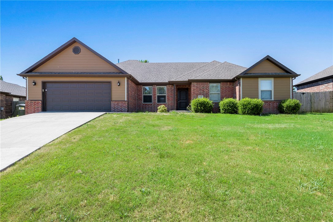 Looking for your forever home with some amazing community amenities and close to Bentonville West High School? Your search is over! This lovely home is located in Sienna Estates and offers a community pool, club house, rec room and playground. When you walk in the front door, prepare to fall in love with the large, open concept kitchen, living and dining room. Cozy, corner gas log fireplace adds ambiance. Beautiful granite counters and stainless steel appliances in kitchen. Huge, double-doored pantry for storage. All appliances convey! Master with ensuite bath boasts his and hers walk-in closets, double vanity, soaking tub and separate walk-in shower. Split bedroom floor plan with three more roomy guest bedrooms and full bath. Privacy fenced backyard offers a covered patio for those morning coffee sessions and a built-in outdoor grill for the grill master!