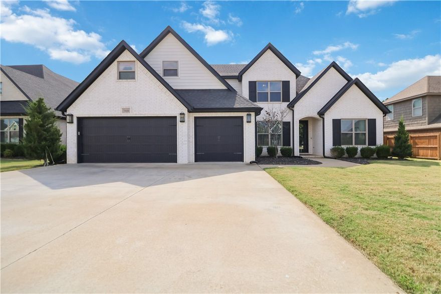 Beautiful Landmark Custom Home in West Rogers! This immaculate 4-bedroom home offers an office and oversized bonus room, designed with an open-concept floor plan that is perfect for entertaining. The stunning kitchen features a walk-in pantry, granite countertops, built-in stainless appliances, and a 5-burner gas cooktop. Gorgeous beams and a custom fireplace wall create a warm focal point in the living area, while the modern, light, and airy design flows throughout the home. The spacious primary suite and additional guest suite are conveniently located on the main level, with two more bedrooms and a large bonus room upstairs. The garage boasts a custom epoxy floor and was partially converted into a game-day lounge—the wiring and electrical remains if you would like to keep this unique feature. Enjoy neighborhood amenities including a community pool, plus a prime location close to parks, schools, shopping, dining, and the Razorback Greenway. A perfect blend of style, function, and location, this home is a​​‌​​​​‌​‌​​​‌‌​​​‌‌‌​​‌​​‌‌​​​​ must-see!