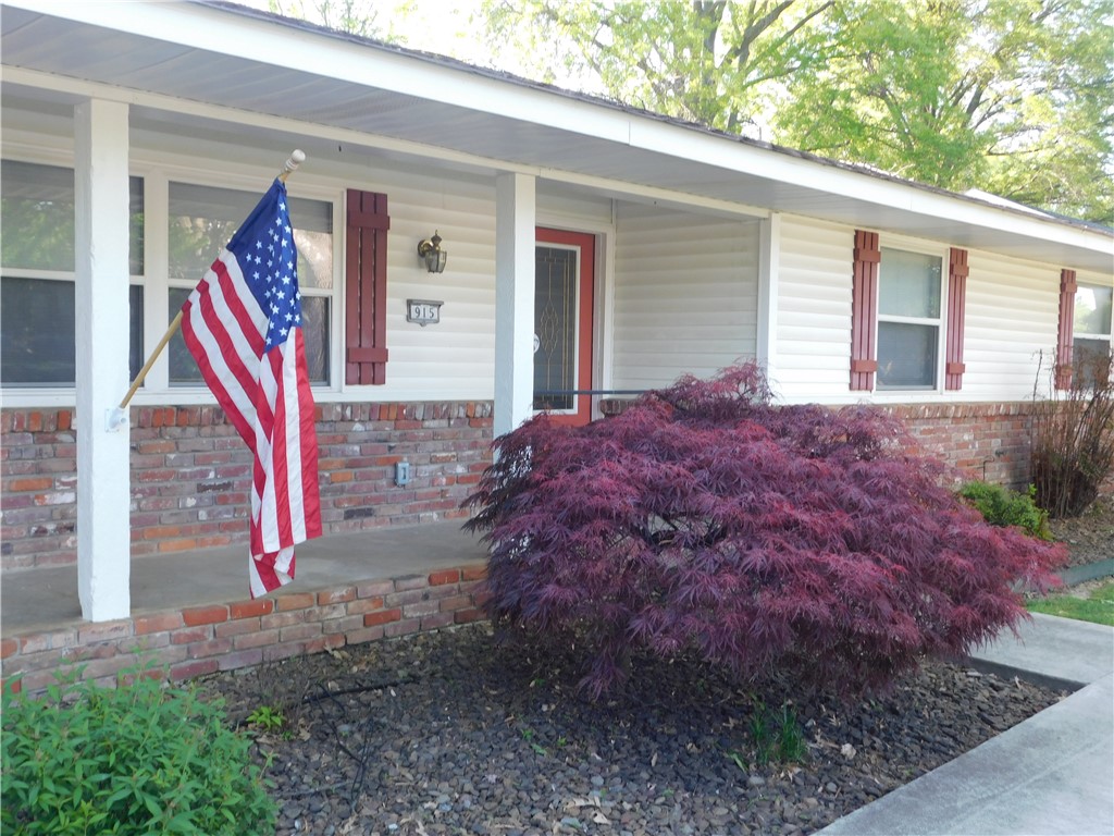 This is an non-smoking environment. Delightful one-story family home with a huge backyard on quiet street walking distance to schools, shopping, and Rogers Public Library. Four bedrooms with two full baths, large den with fireplace, beautiful and spacious sunroom, seperate living room and an office. Eat-in kitchen includes a bar. New flooring throughout and freshly painted interior. Two refrigerators as well as washer and dryer. Large two car garage with builtin storage shelves and cabinets. Large front porch, perfect for rocking chairs as well as patio in backyard. Pets will be considered with nonrefundable pet fee of $600.00. A house trained dog 40 lbs or less will be considered. No feline. Yard to be maintained by owner for an additional $150.00 per month.
