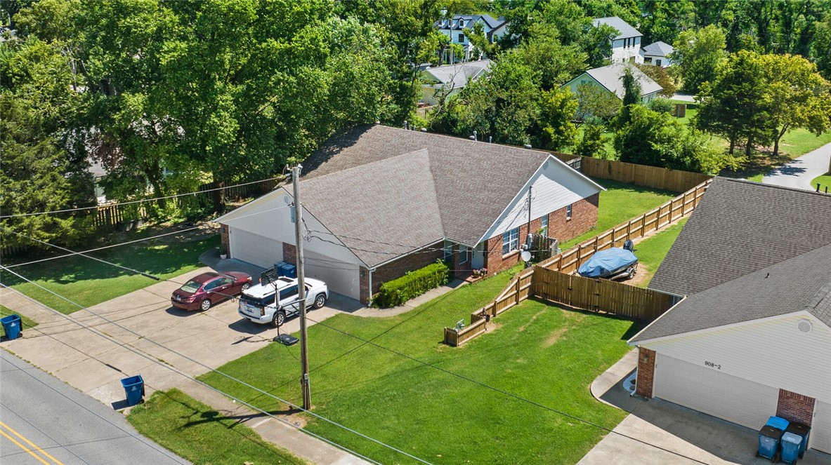 Fabulous duplex in downtown Bentonville. Walk to the square, ride the trails, live in one side and Air BNB the other. Create an income stream. Repurpose the lot and build your dream home or go big and go future land use of medium or high density residential. The possibilities are only limited to your imagination. Some recent updates include new vinyl plank flooring, cabinets, closet shelving and more.