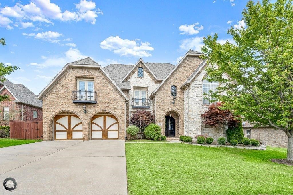 Infused with elegance and charm, 5106 Sloan Circle is a stunning property nestled in the heart of Rogers, AR. This spacious 4,612 square foot home boasts four generously sized bedrooms, three full baths, and two half baths, providing ample space for comfort and relaxation. The heart of the home features a cozy fireplace, perfect for gathering around on chilly evenings. Culinary enthusiasts will adore the kitchen, adorned with sleek granite countertops that beautifully complement the rich hardwood floors. Expansive windows throughout the property invite an abundance of natural light, creating a warm and inviting atmosphere. Each room is thoughtfully designed to blend functionality with a touch of luxury, making it ideal for both entertaining and everyday living. The layout flows effortlessly, providing an open and airy feel while maintaining distinct and intimate spaces. Situated on a tranquil cul-de-sac, the home offers privacy and serenity, yet remains conveniently close to local amenities.
