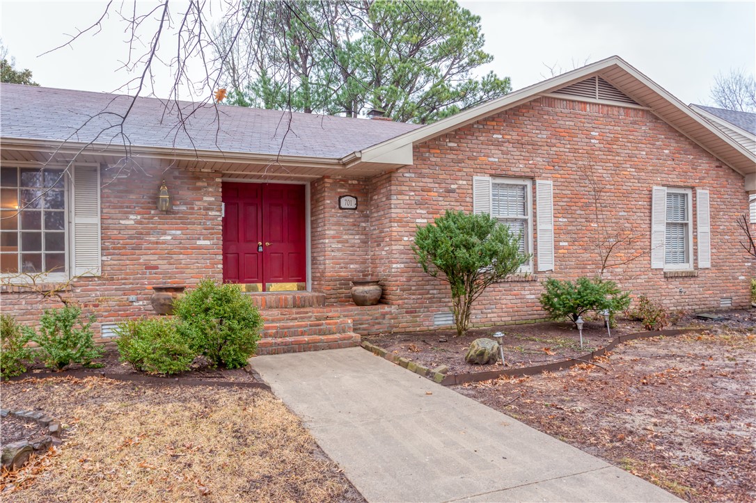 Check out this all brick 3 bedroom, 2 bath home located near schools and shopping in the heart of Springdale. Large corner lot with side entry oversized garage with 8 foot overhead doors. Large rock wood burning fireplace, 2 living area, large laundry, and oversized bedrooms and a pool. A MUST SEE!!