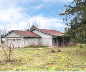Looking for a perfect place on the edge of town? This lovely home features 3 bedroom, 2 full baths, nice living room and large kitchen! Great yard for gardening and gathering with 1.17 acres.