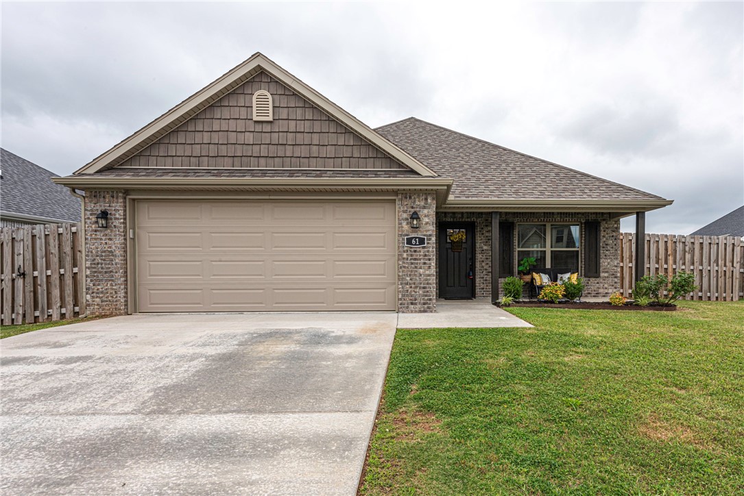 WELCOME HOME! This beautiful 3 bedroom 2 bathroom home is conveniently located near parks, schools, eateries, shopping, I-49 and the University of Arkansas Campus! From the covered front porch head into the open concept living room with Luxury Vinyl Plank Flooring, crown molding, and gas log fireplace! Enjoy an L-shaped eat-in kitchen with stained cabinetry, granite countertops, stainless steel appliances,grey subway tiles, and raised bar! Relax and rejuvenate in the primary bedroom with tray ceiling and private ensuite feat: dual sink vanity, and walk in closet! Plus two additional bedrooms and one bathroom. Head out back to the extended covered back patio overlooking the fenced in back lawn perfect for the upcoming summer months. REFRIGERATOR INCLUDED! Don’t Miss Out! Act Now!