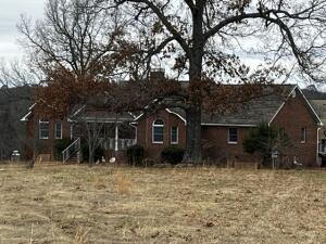 All Brick 3 Bedroom with finished basement for potential additional bedrooms. Cathedral Ceilings with propane fireplace. On appx 18 AC private Acres with Metal shop.