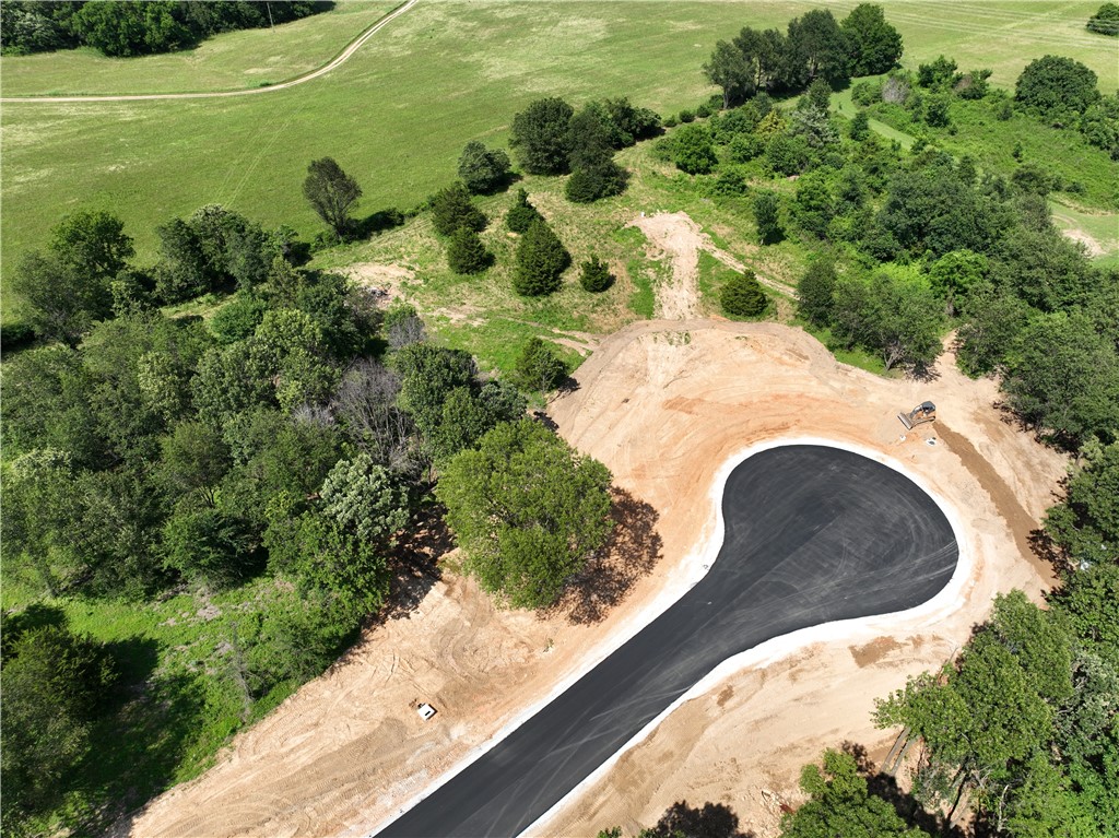 Discover the perfect setting for your dream home on these breathtaking estate lots! With paved roads, city water, and a 2,200 SF minimum, these private homesites offer a blend of luxury and tranquility. Enjoy stunning views in a prime location, providing both seclusion and convenience. Don’t miss this rare opportunity to build in a truly exceptional setting. In total there are 27 lots. Subject to final plat