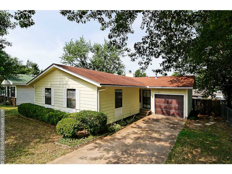 Great location. Three bedroom/two bath home with large living room, lament wood floors, brick fireplace, vaulted ceilings and wet-bar. Master bedroom has walk-in closet and private bath with shower. Fenced backyard,large deck for relaxing & entertaining.,Home has new windows.