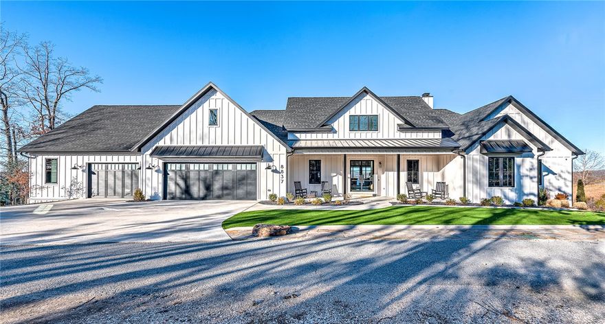 Experience lakefront living in this 2024 custom Beaver Lake retreat, with one slip in a 4-slip dock & breathtaking panoramic views. Walls of glass frame the water, while a dramatic wood-burning fireplace anchors the open-concept living space.The luxury kitchen features premium finishes, designer appliances, and a walk-in pantry with direct garage access. A stunning 1,327 sq ft covered deck offers remote screens, heat lamps, an outdoor grill, and a second wood-burning fireplace—your private outdoor living room overlooking the lake. The main level includes a private primary suite, three additional bedrooms, two full baths, laundry, and a half bath. The walk-out lower level delivers a resort-style experience with a golf simulator, gym, wine cellar, safe room, and private ADU with two bedrooms, full kitchen, and bath—ideal for guests or income potential.Complete with a private pickleball court, hot tub, fire pit, oversized epoxy-floored garage, workshop, and storage, this rare offering defines luxury lakefront living.