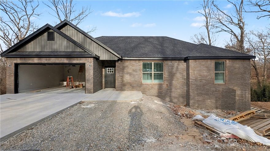 Welcome To Your Next Home! This Bella Vista Beauty Brings The Perfect Mix Of Style, Space, And Location! This Home Puts You Right In The Middle Of It All. Step Inside To Find 9-Ft Ceilings, A Wide-Open Living Area With A Cozy Corner Fireplace, And A Layout That Just Flows. The Kitchen? Custom Cabinets, Granite Counters, Tile Backsplash, Under-Cab Lighting, Walk-In Pantry, Island Seating, And Roomy Dining Space For Every Occasion. The Primary Suite Hits All The Right Notes With A Walk-In Closet Big Enough To Actually Use, A Soaker Tub, Tile Shower, And Dual Vanity Setup. Two Additional Bedrooms Plus A Full Hall Bath With Double Vanity Complete The Smart Floorplan. Out back, unwind on the covered deck overlooking a freshly sodded yard—ideal for BBQs, quiet evenings, or your morning coffee. And when you’re ready to get out and explore, you’re just moments from Branchwood Trail, the golf course, and disc golf.