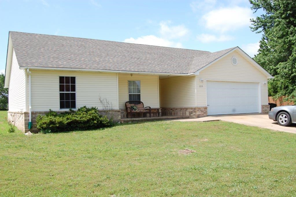 Cute covered front porch, 3 bedroom on half an acre. Nice open living room, kitchen, pantry and utility room. New hardwood floors and new water heater. Large backyard.