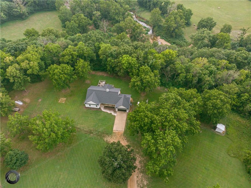 What an amazing piece of property situated in Northwest Arkansas and just 29 minutes to Bentonville! There are so many opportunities here with all this space, indoors and outdoors! Start a farm, visit Spavinaw Creek, ride ATVs and just enjoy all this amazing place has to offer. Seriously the opportunities are endless ! Go see this yourself and soak it in! House has been completely remodeled inside and out!! New roof, new hardi siding, new paint, new cabinets, new flooring, lighting, etc! This place is amazing!! 1050 sq ft basement is included in heated sq ft.