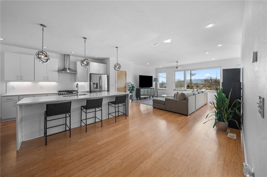 Stunning contemporary, energy-efficient home in the highly sought-after SoFay district, part of The Mill Project by Jacobs Group. Perfectly positioned in one of Fayetteville’s most vibrant locations—directly across from Mamaka Bowls, steps from the Razorback Greenway, within walking distance to the Square & Walmart. This high-end, three-story property offers exceptional design and thoughtful upgrades throughout. The beautifully renovated kitchen features brand-new appliances, quartz countertops, a dramatic waterfall island, and modern finishes ideal for both everyday living and entertaining. Designed with efficiency in mind, the home includes solar panels to help reduce utility costs, along with new windows and new siding for enhanced performance and curb appeal. Upgrades list attached. Enjoy magnificent southern views and abundant natural light throughout the home. Interior features include bamboo flooring, new tile, and carefully selected finishes that elevate the living experience. Professionally landscaped.