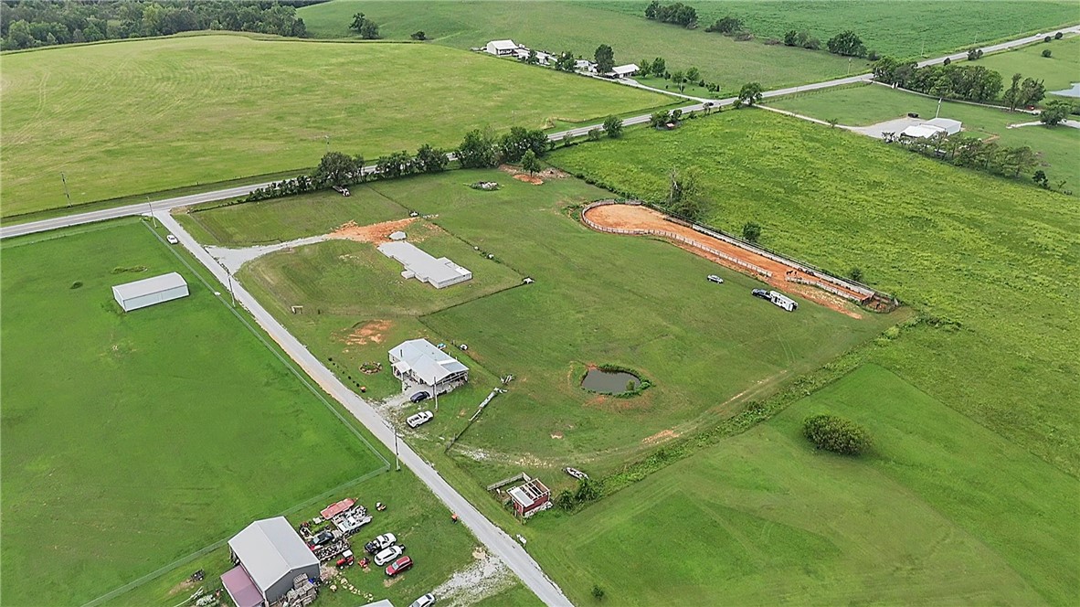 6+/- acres, all flat, and clear , basement stated , sellers will share house plan , tornado shelter will be located on your back patio āalmost finished ā. Perfect location, peaceful place , great location to build your business shop or just enjoy the extra space . Water , and electricity on site , septic needed. Professional pictures coming soon ? !
