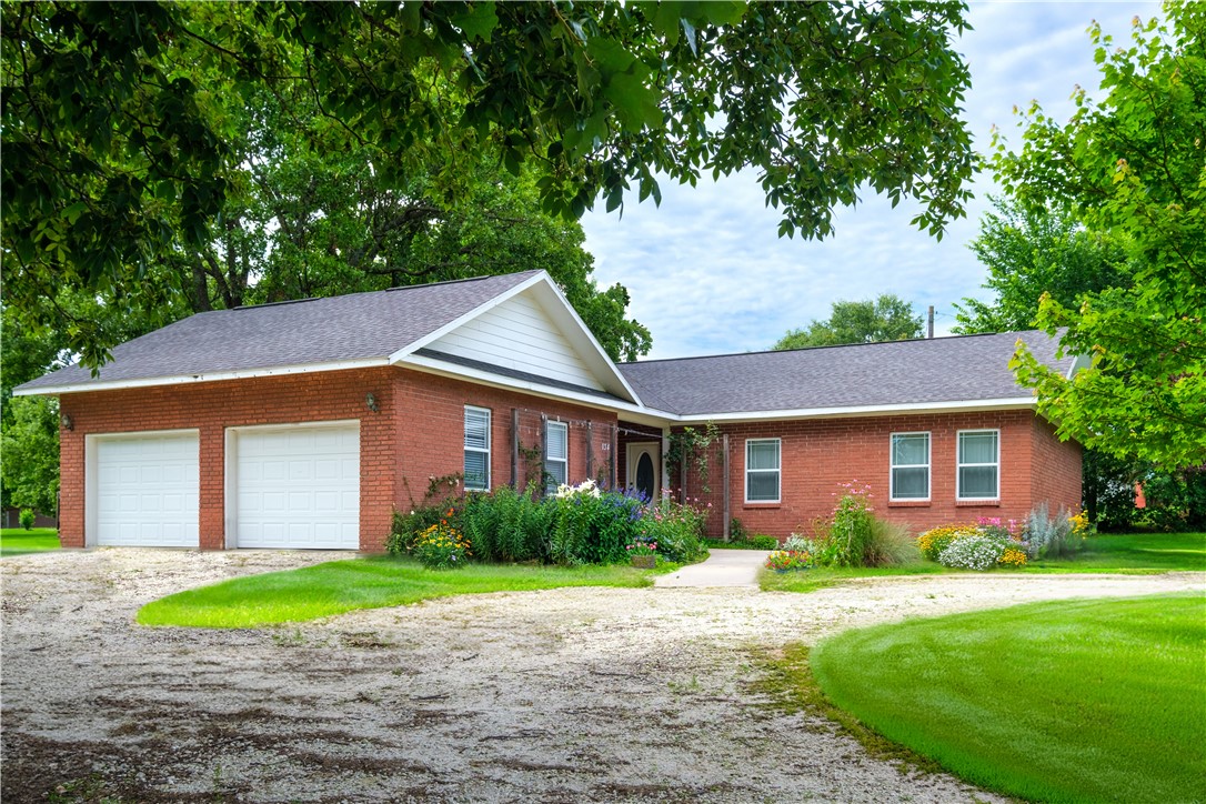 This beautiful 4-bedroom, 2-bathroom home features a seamless open floor plan and beautiful hardwood floors throughout. The living room boasts an exposed brick wall, adding a touch of character and charm. The updated kitchen includes stainless steel appliances and a spacious pantry for all of your storage needs. Enjoy outdoor living on the oversized deck in the peaceful backyard, perfect for entertaining or relaxing. Nestled on a half-acre lot, this property offers ample space for families of all sizes. Located close to I-49, the home provides easy access to shopping, dining, and more!