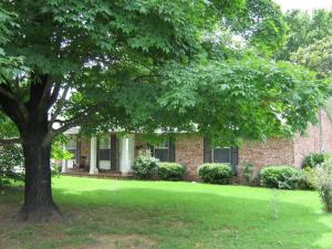 Great family home features large rooms, remodeled kitchen. Delightful dwelling has newer paint, stainless steel appliances, HWH. New garage door! 2 family rooms, spacious bedrooms. Backyard is fenced. Bricked front porch, large shade trees. Additional room would make a great office! This is a highly desirable location!
