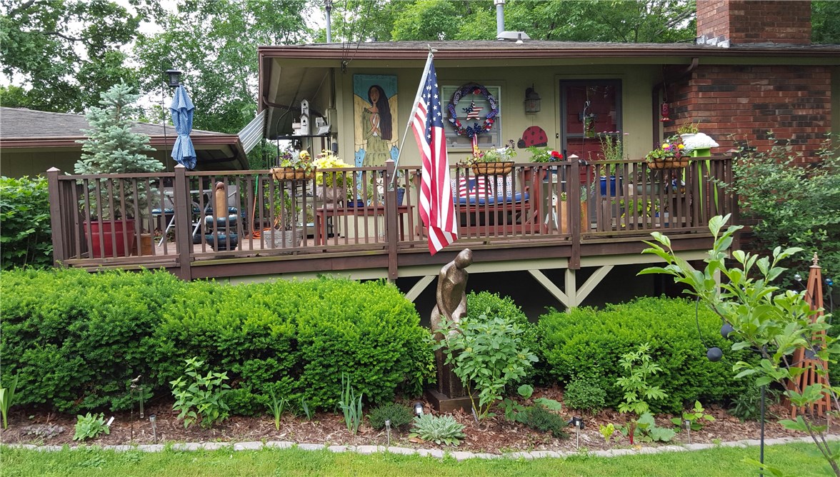 if you're a gardener, an artist or you appreciate something "different" you want to see this architect designed upside-down house - the square floor plan yields wide open space upstairs and large bedrooms, closets and bathrooms - stone wood burning fireplace - decks surround both levels for relaxing and watching the bamboo, birds and wildlife - over-sized 2 carport has space for table and chairs with workshop under - HVAC 2010- roof 2006- small cul de sac -great neighbors - easy access to 71 or Walmart