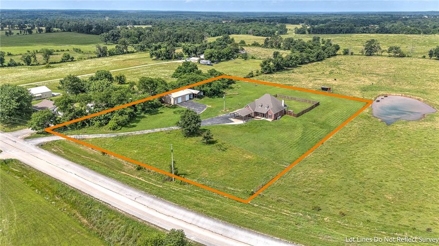 Come see this estate escape in Bentonville! This home has 6 bedrooms, and 4.5 bathrooms with over 3600 square feet to enjoy! Three options for primary bedroom suites/ensuites, with the newest remodel being upstairs and downstairs bathrooms. Some additional things to note are the large closets, generator hookup capability, public water, all electric, kitchen remodel and upstairs remodel 2019, wood burning fire place,  huge attic walk in storage, new survey and so much more to see!  To make this home even more appealing there are 3 flat acres included, along with a large 30X50 shop, and RV parking space and hookups. Looking for peaceful living, but close to I-49 and everything local just minutes away?! This is it! Check out the potential of making this large home yours, enjoying the sunset dinner views, and tinkering around your very own private shop.