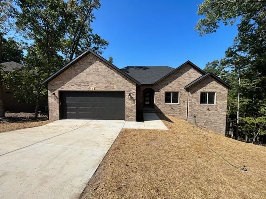 Beautiful New Construction by Elite Thomas Homes – Near the Back 40 Trails!
Don’t miss your chance to own this stunning new build by Elite Thomas Homes, just 0.3 miles from Back 40 trail access and 1.1 miles to Lake Ann. Enjoy an open-concept floor plan with vaulted ceilings, wood beams, and a stacked-stone gas fireplace. The spacious kitchen flows into the dining and living areas with access to a large covered and uncovered deck, perfect for entertaining.
The main level features 2 bedrooms, an office, 2 baths, and an oversized 2-car garage. The primary suite offers a walk-in closet and a spa-like bath with dual vanities, a tiled shower, a freestanding tub, and a separate toilet room for added privacy.
The partial walkout basement includes a media/game room with bar area, a 3rd bedroom with walk-in closet, full bath, and a second covered deck to enjoy the peaceful surroundings.