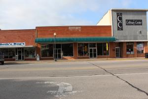 13 parking spaces in the back. Additional detached building of 1000 sq. ft. in the back is rented for $150.00. Great location. Will consider a trade for a house in Harrison.